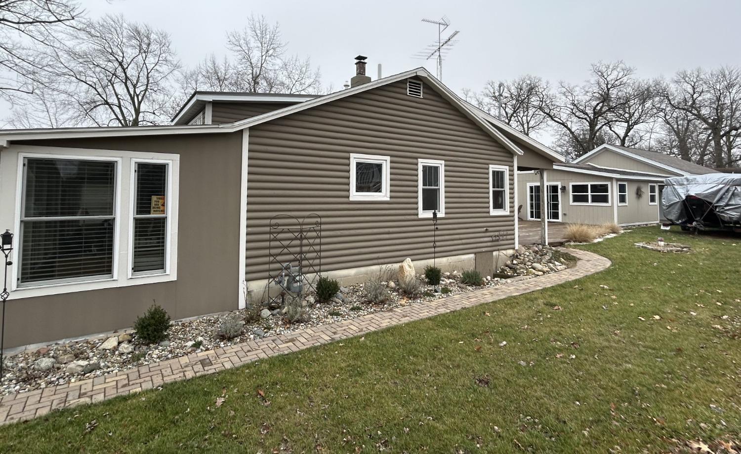 4756 East Rannells Road North Knox, IN 46534 - Photo 17 of 34 a front view of a house with a garden