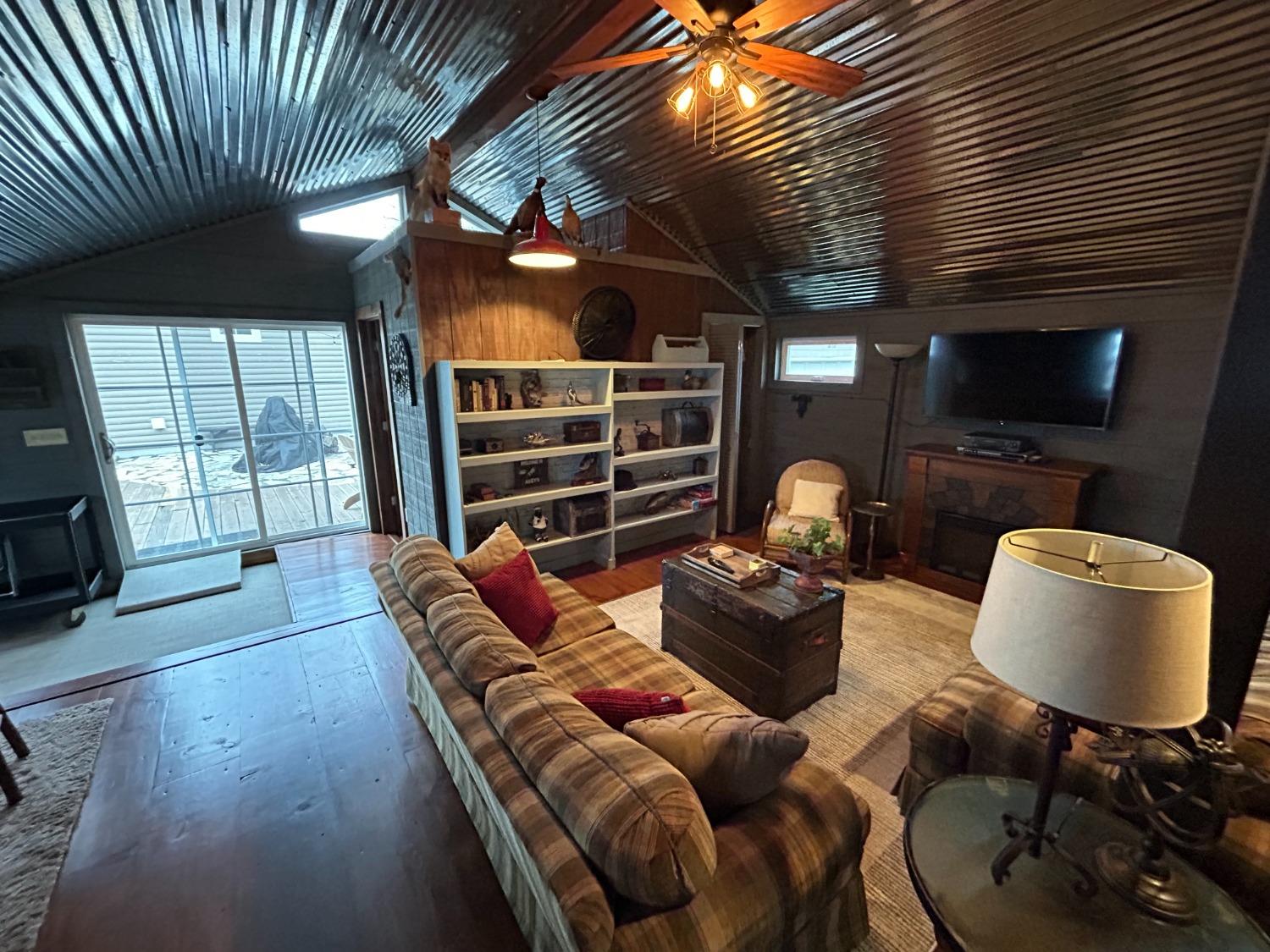 4756 East Rannells Road North Knox, IN 46534 - Photo 26 of 34 a living room with furniture a flat screen tv and a fireplace