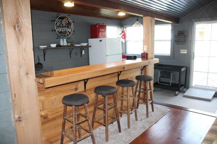 4756 East Rannells Road North Knox, IN 46534 - Photo 28 of 34 a kitchen with stainless steel appliances granite countertop a table chairs and a refrigerator