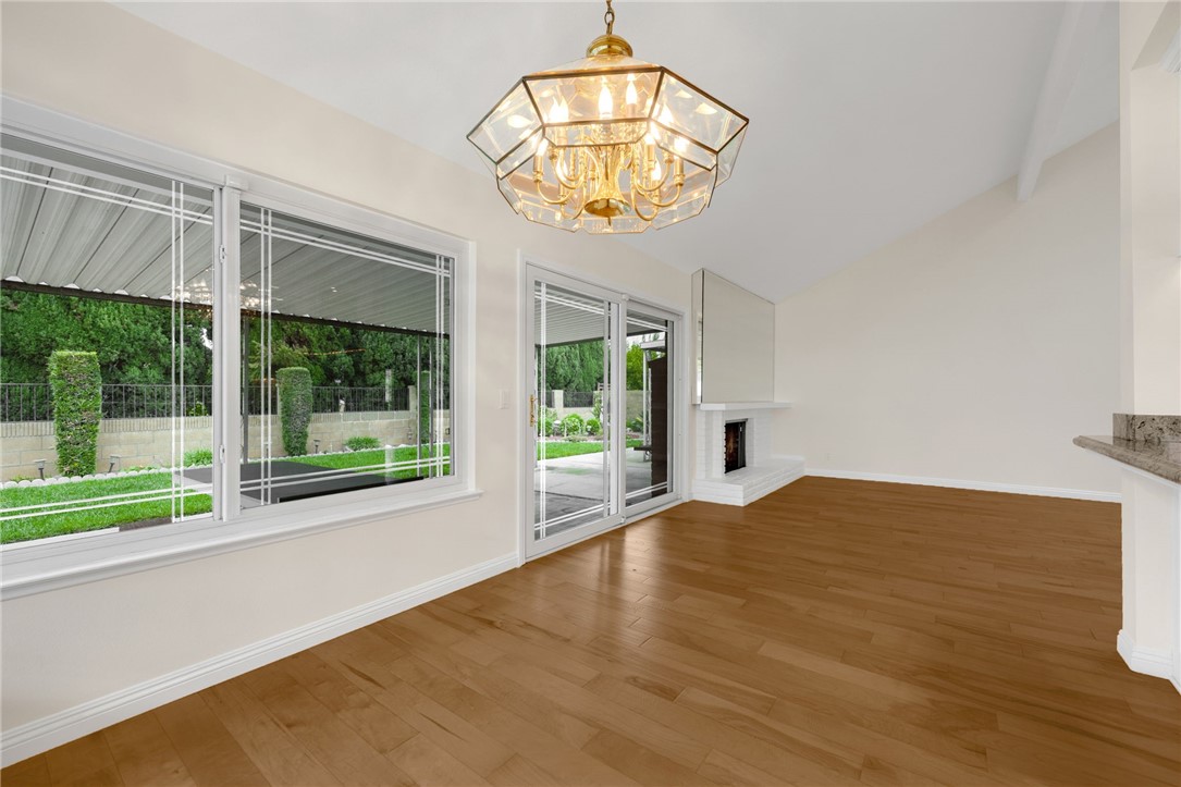485 Castlegate Lane Brea, CA 92821 - Photo 14 of 41 a view of an empty room with a window and a chandelier