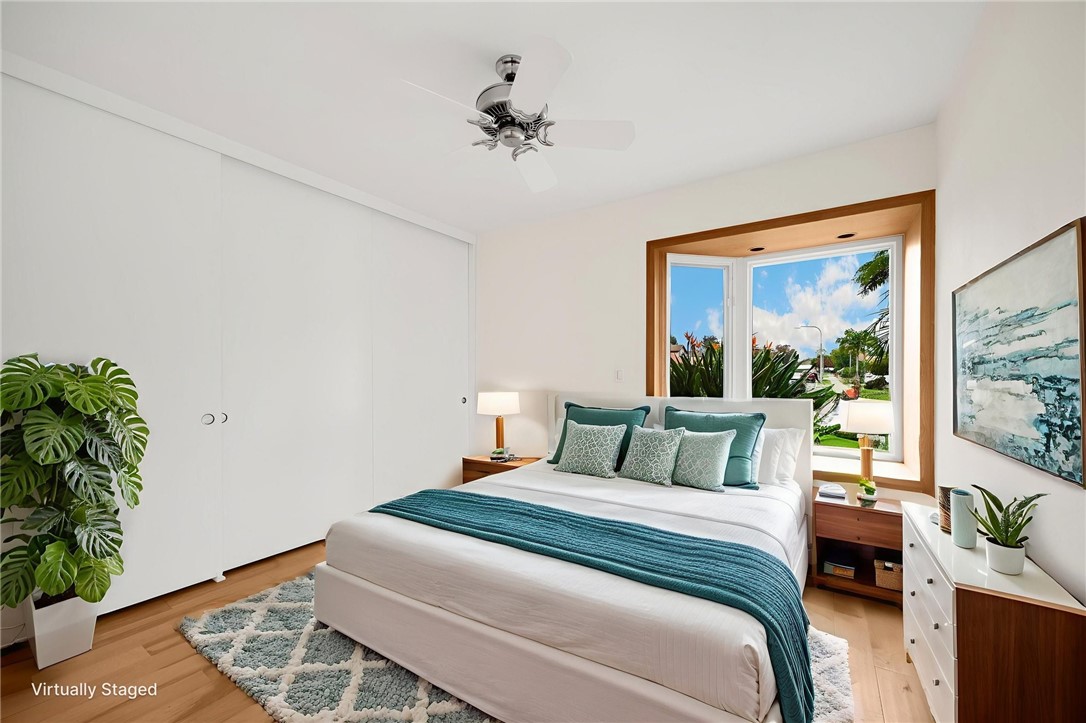 485 Castlegate Lane Brea, CA 92821 - Photo 18 of 41 a bedroom with a large bed and a potted plant