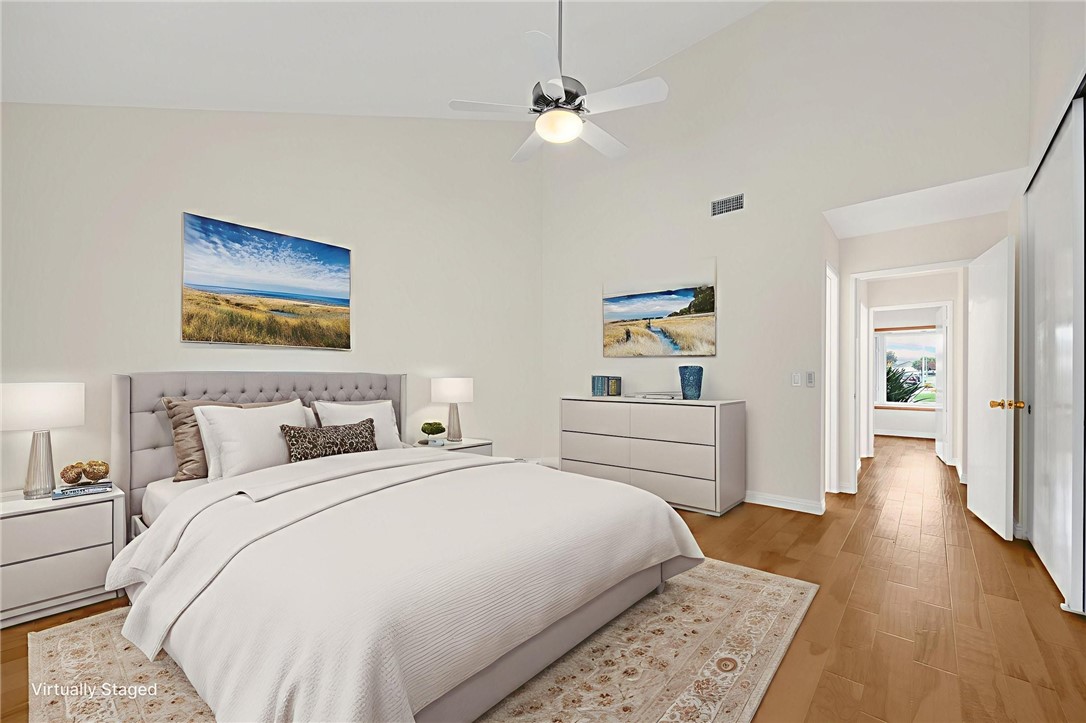 485 Castlegate Lane Brea, CA 92821 - Photo 20 of 41 a bedroom with a bed and a chandelier