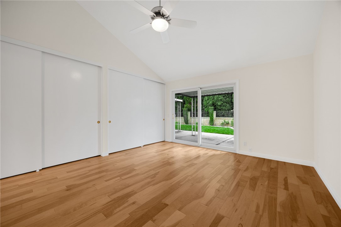 485 Castlegate Lane Brea, CA 92821 - Photo 22 of 41 a view of an empty room with wooden floor and a window