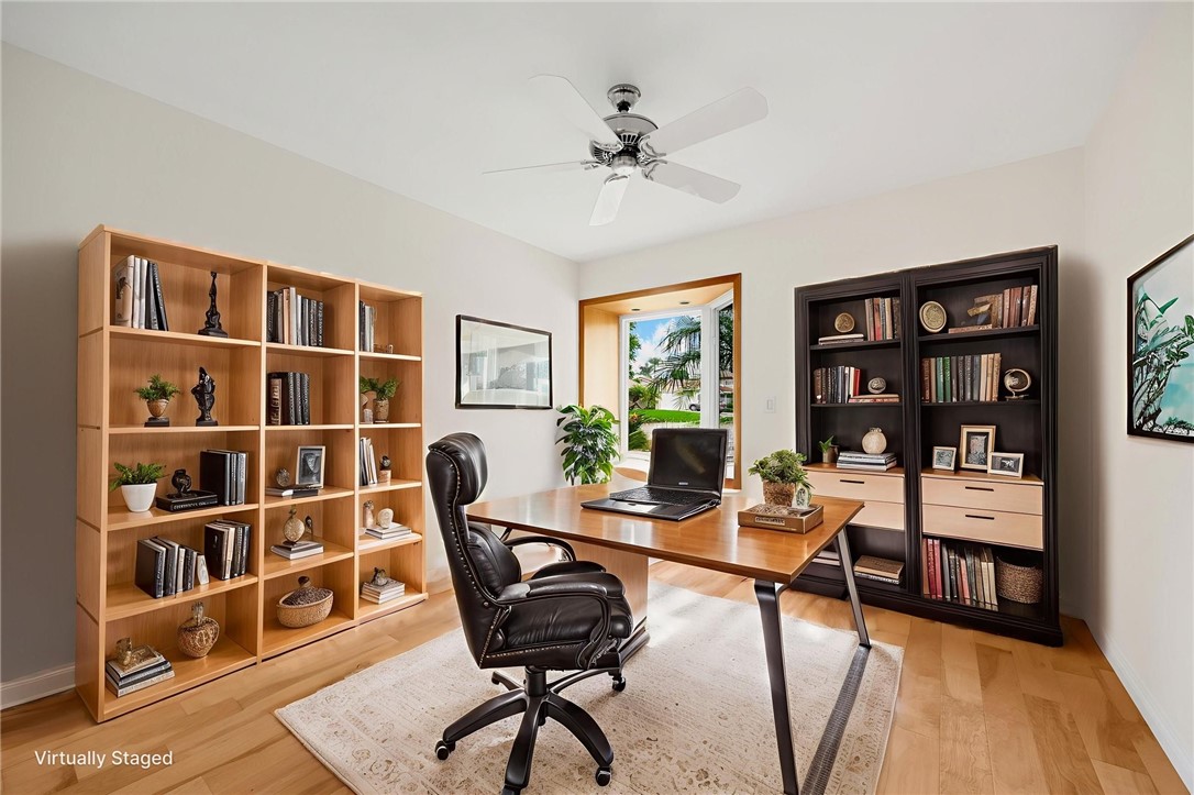 485 Castlegate Lane Brea, CA 92821 - Photo 24 of 41 a view of a workspace with furniture and a bookshelf
