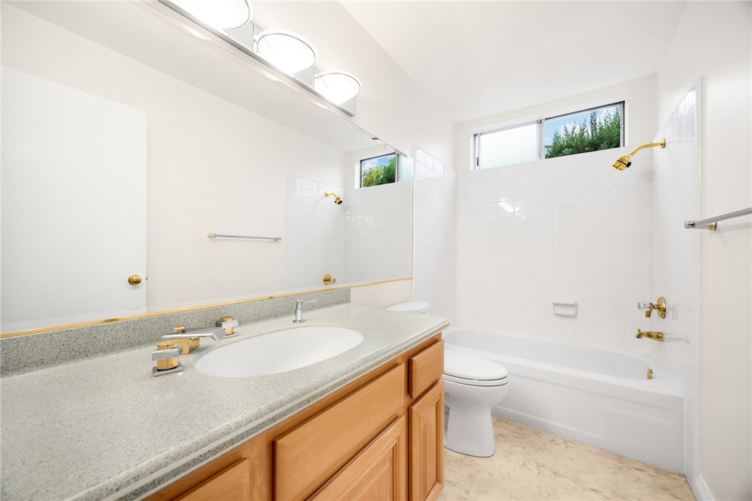 485 Castlegate Lane Brea, CA 92821 - Photo 27 of 41 a bathroom with a granite countertop sink a toilet and shower