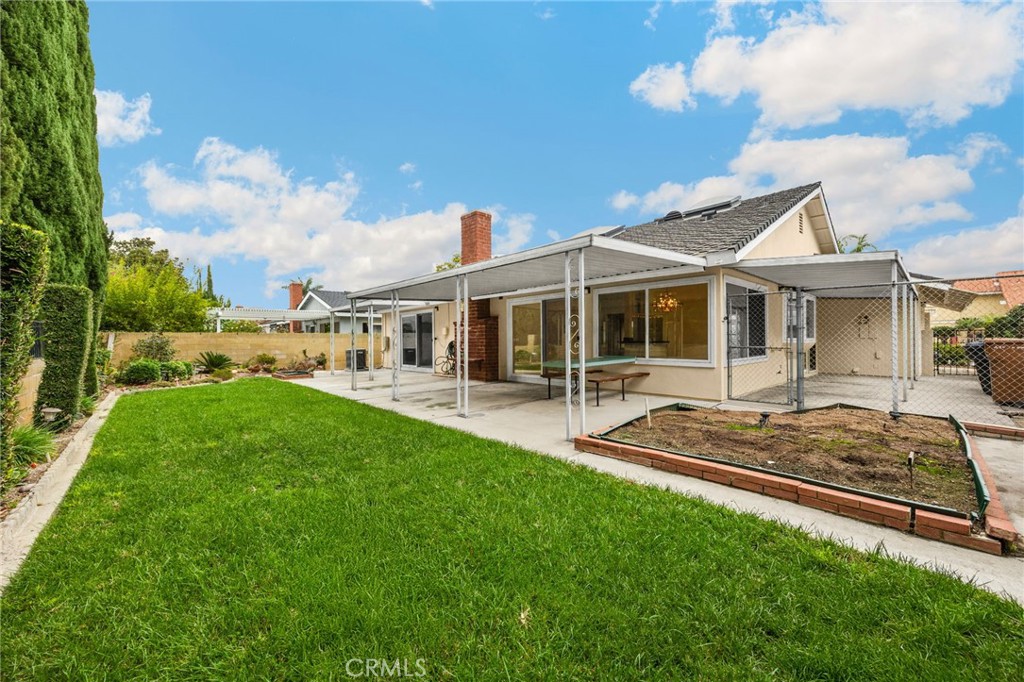 485 Castlegate Lane Brea, CA 92821 - Photo 31 of 41 a view of a house with a backyard porch and sitting area