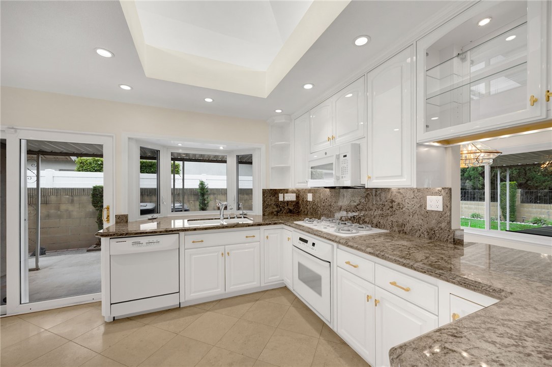 485 Castlegate Lane Brea, CA 92821 - Photo 7 of 41 a kitchen with a sink and cabinets