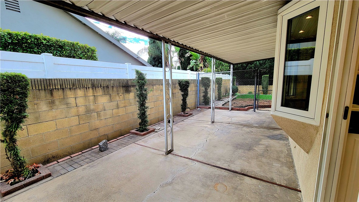 485 Castlegate Lane Brea, CA 92821 - Photo 9 of 41 a view of a patio with table and chairs and potted plants