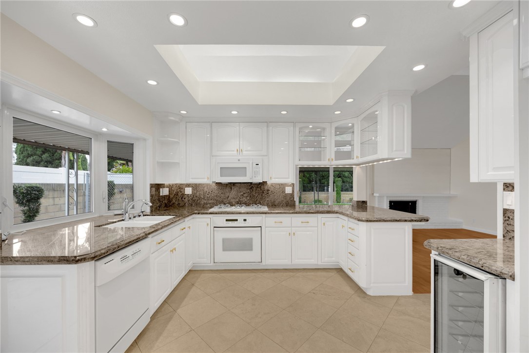 485 Castlegate Lane Brea, CA 92821 - Photo 10 of 41 a large kitchen with granite countertop a sink and cabinets