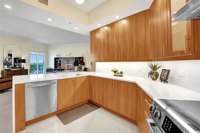 a kitchen with a refrigerator sink and stove