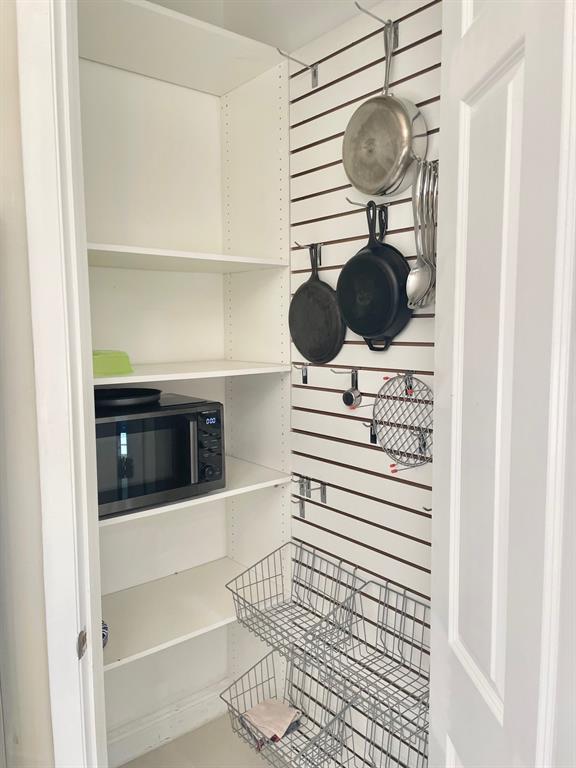 2617 Northeast 14th Avenue, Unit 507 Wilton Manors, FL 33334 - Photo 15 of 65 a kitchen with a sink and cabinets