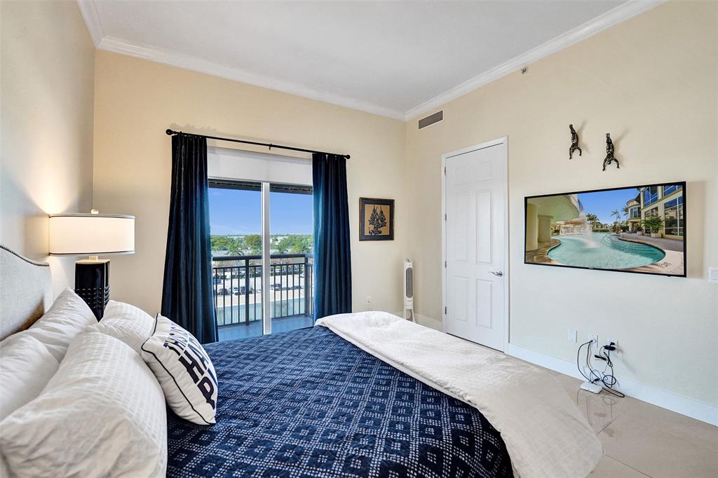 2617 Northeast 14th Avenue, Unit 507 Wilton Manors, FL 33334 - Photo 18 of 65 a bedroom with a bed and a window