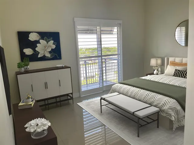 a bedroom with bed and wooden floor