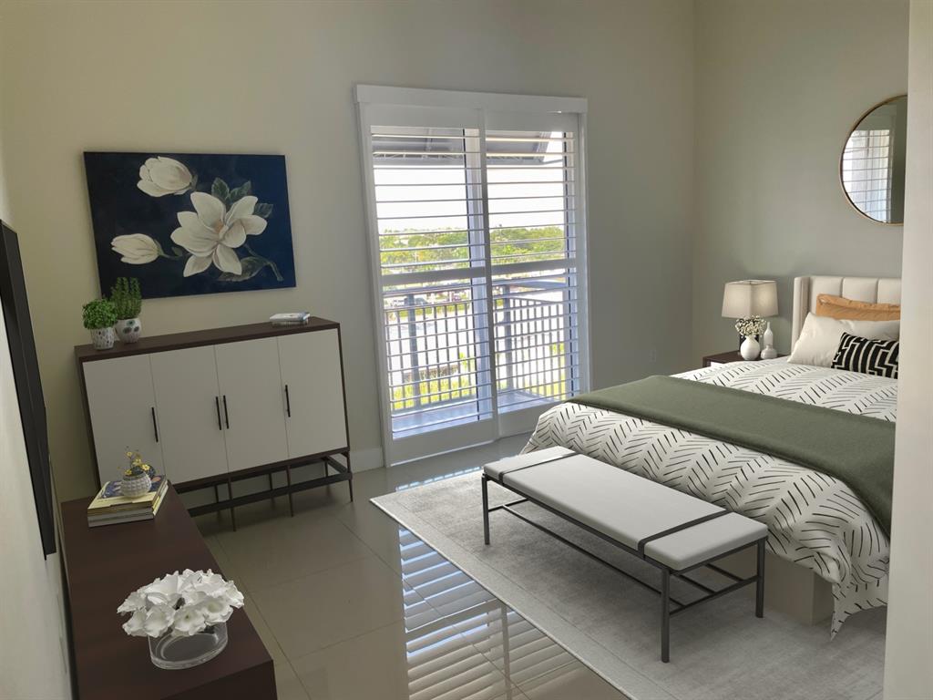 2617 Northeast 14th Avenue, Unit 507 Wilton Manors, FL 33334 - Photo 23 of 65 a bedroom with a bed and a window