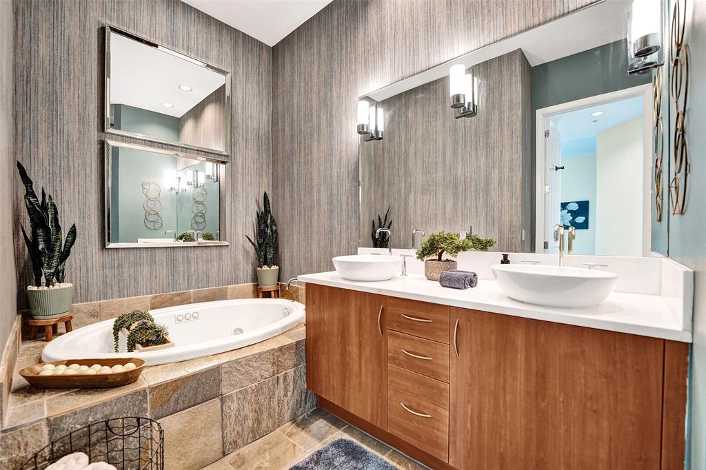 2617 Northeast 14th Avenue, Unit 507 Wilton Manors, FL 33334 - Photo 28 of 65 a bathroom with a tub sink and mirror