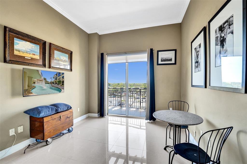 2617 Northeast 14th Avenue, Unit 507 Wilton Manors, FL 33334 - Photo 30 of 65 a bedroom with furniture and a window