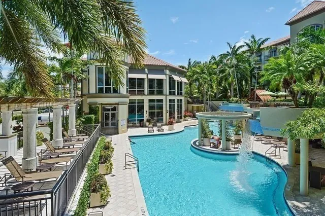 a view of a house with backyard sitting area and garden