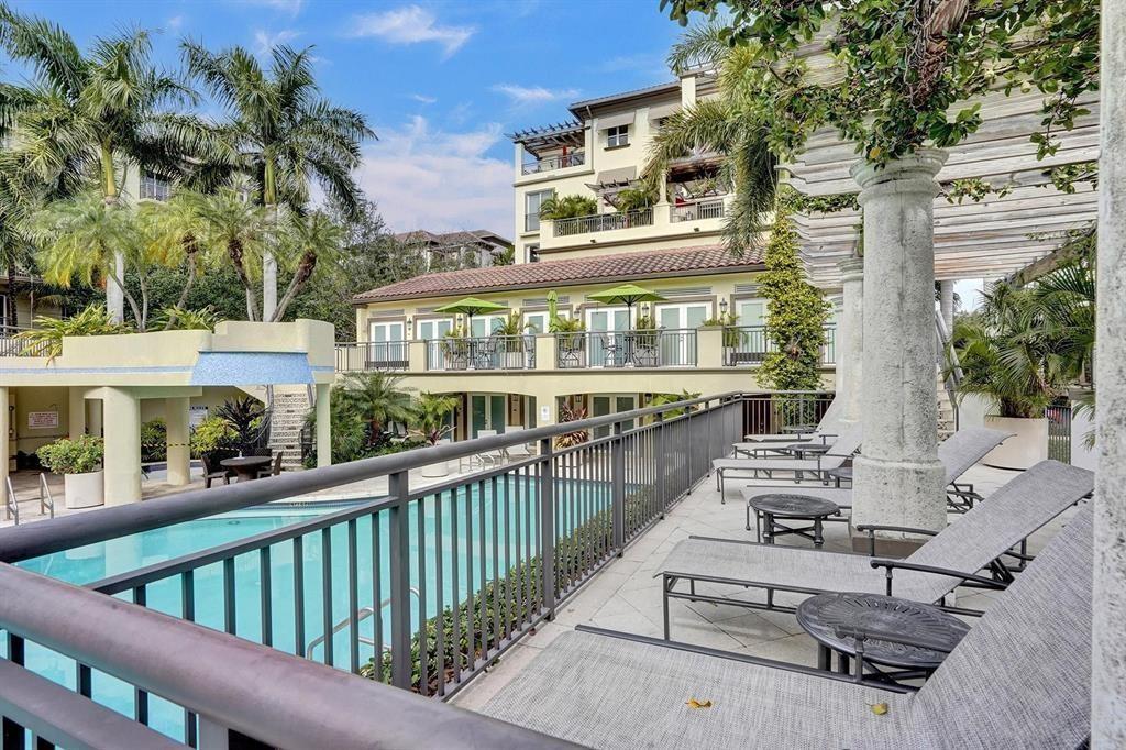 2617 Northeast 14th Avenue, Unit 507 Wilton Manors, FL 33334 - Photo 38 of 65 a balcony with furniture and a potted plant