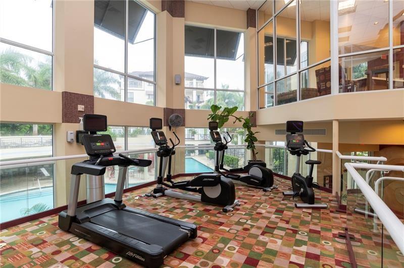 2617 Northeast 14th Avenue, Unit 507 Wilton Manors, FL 33334 - Photo 41 of 65 a room with gym equipment and a rug