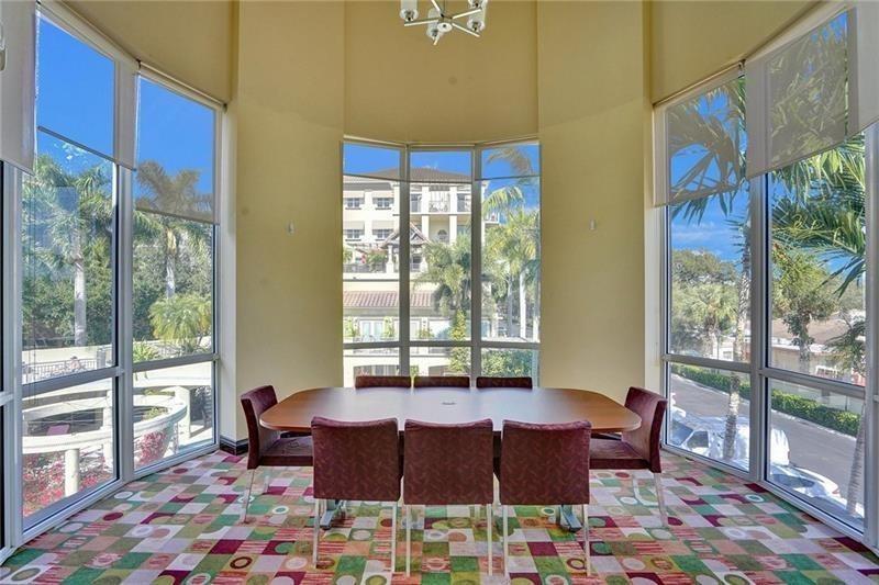 2617 Northeast 14th Avenue, Unit 507 Wilton Manors, FL 33334 - Photo 50 of 65 a living room with furniture and a floor to ceiling window