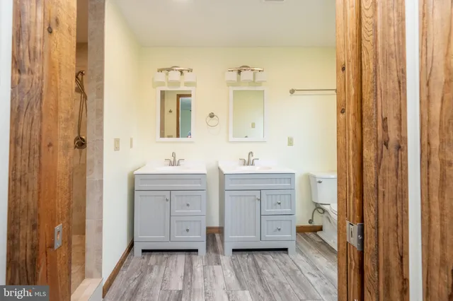 a view of a small space with wooden floor and a window