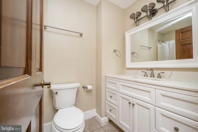 a bathroom with a toilet sink and shower