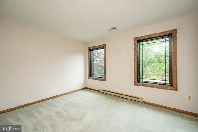 an empty room with windows