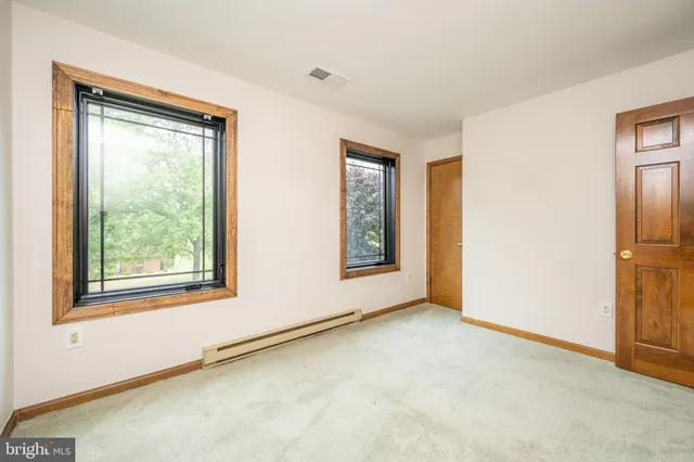 a view of a room with wooden walls
