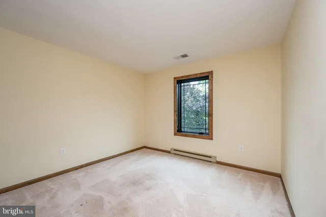 a view of a storage room with furniture and a window