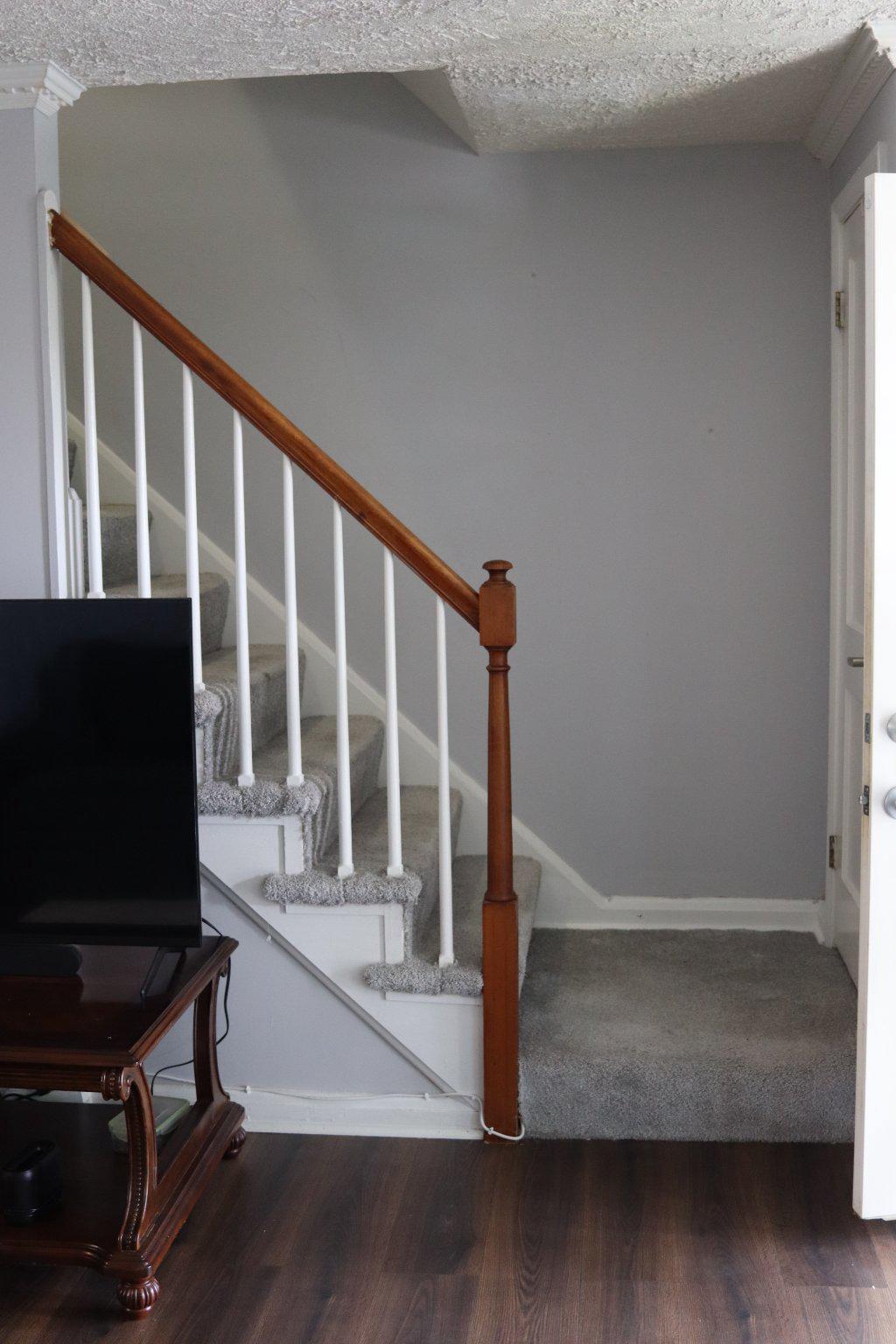 1328 Cedarcroft Road Baltimore, MD 21239 - Photo 5 of 39 Classic staircase with wood banister and carpet.