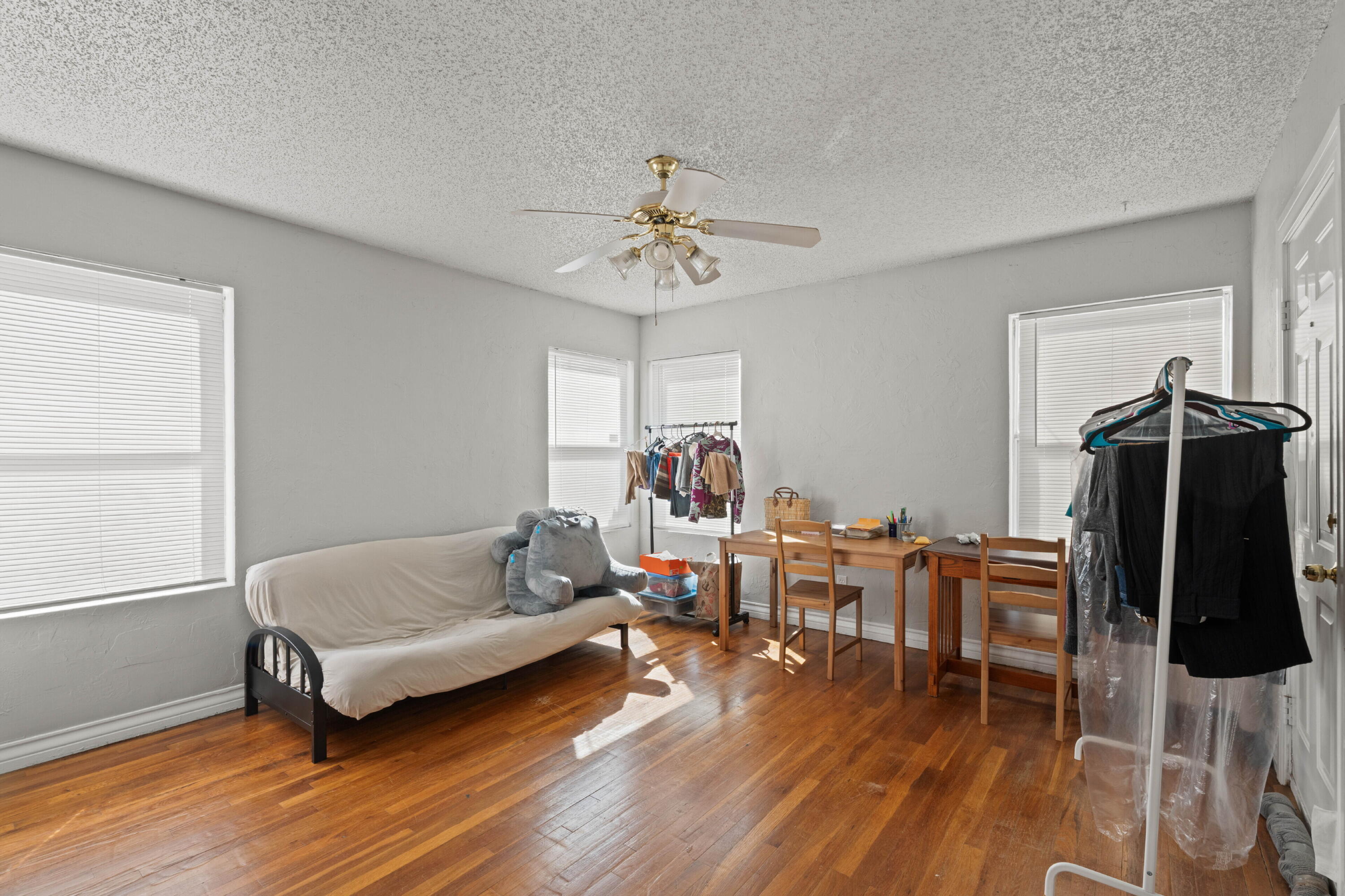 2703 23rd Street Lubbock, TX 79410 - Photo 8 of 11 a living room with furniture and wooden floor