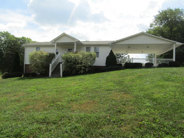 3633 Childress Road Christiansburg, VA 24073 - Photo 1 of 17 a front view of a house with yard and green space