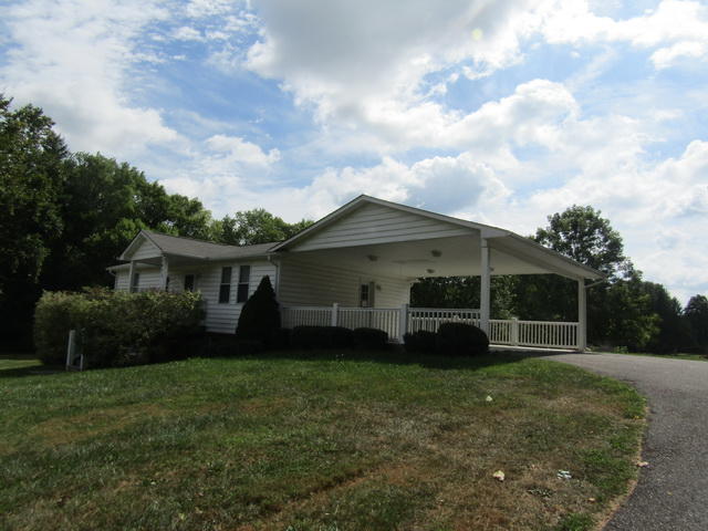 3633 Childress Road Christiansburg, VA 24073 - Photo 2 of 17 a view of a house with a yard