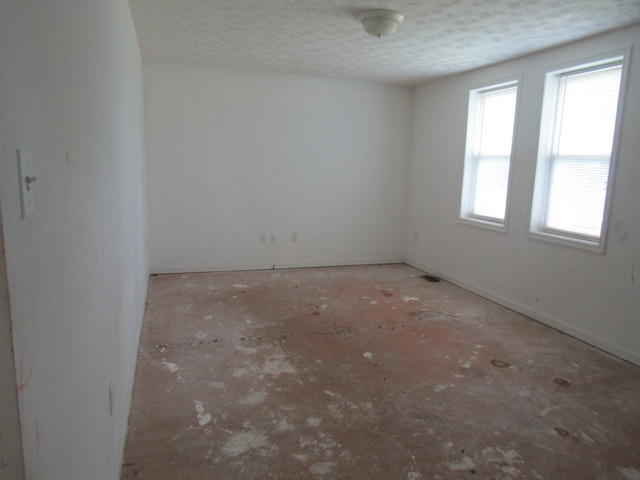 3633 Childress Road Christiansburg, VA 24073 - Photo 5 of 17 an empty room with windows
