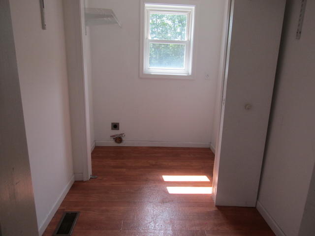 3633 Childress Road Christiansburg, VA 24073 - Photo 10 of 17 a view of an empty room with wooden floor and a window