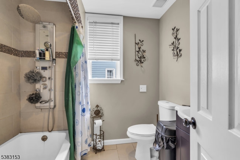 433 3rd Avenue Elizabeth Port, NJ 07206 - Photo 18 of 36 a bathroom with a sink toilet and shower