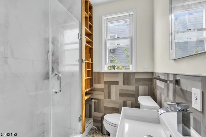 433 3rd Avenue Elizabeth Port, NJ 07206 - Photo 21 of 36 a bathroom with a toilet sink and shower