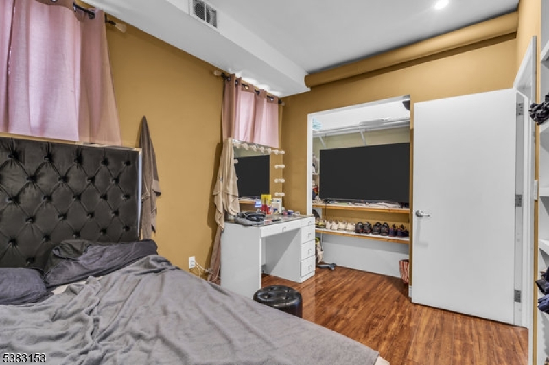 433 3rd Avenue Elizabeth Port, NJ 07206 - Photo 22 of 36 a living room with furniture and a flat screen tv