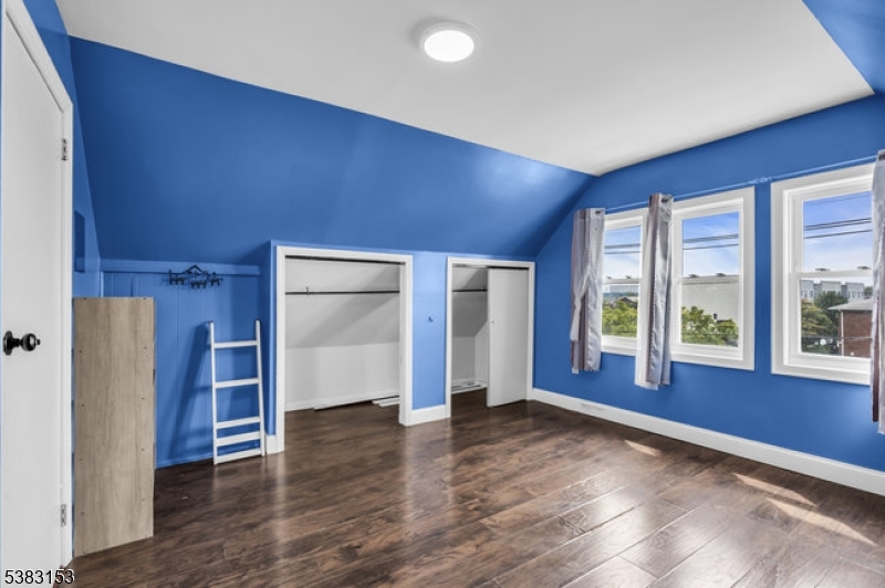 433 3rd Avenue Elizabeth Port, NJ 07206 - Photo 24 of 36 an empty room with wooden floor and windows