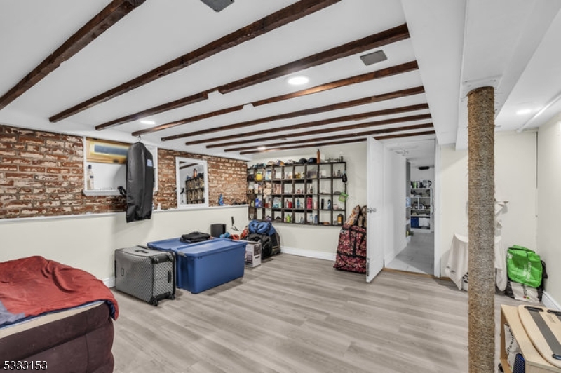 433 3rd Avenue Elizabeth Port, NJ 07206 - Photo 29 of 36 a living room with furniture and stairs