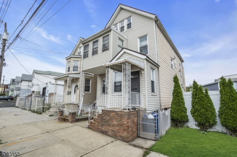 433 3rd Avenue Elizabeth Port, NJ 07206 - Photo 3 of 36 a front view of a house with a yard