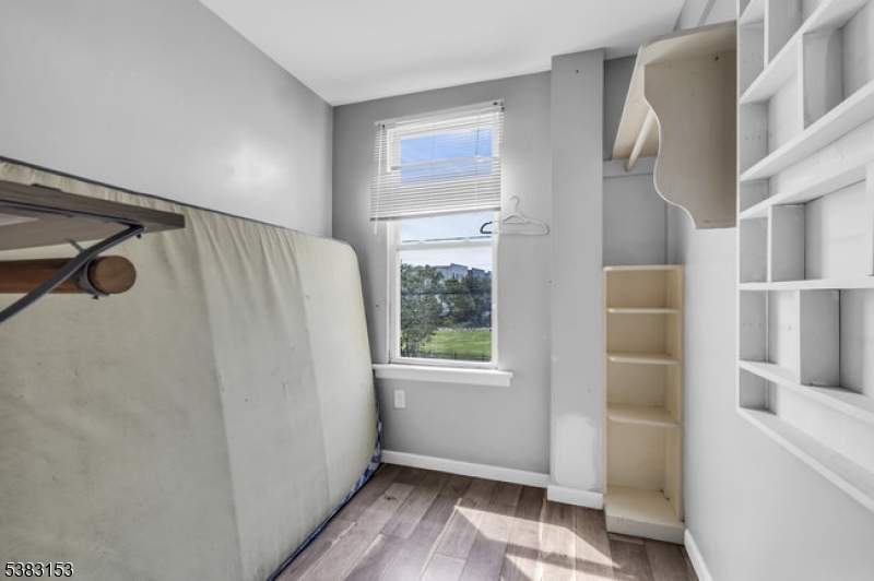 433 3rd Avenue Elizabeth Port, NJ 07206 - Photo 5 of 36 a view of walk in closet with window