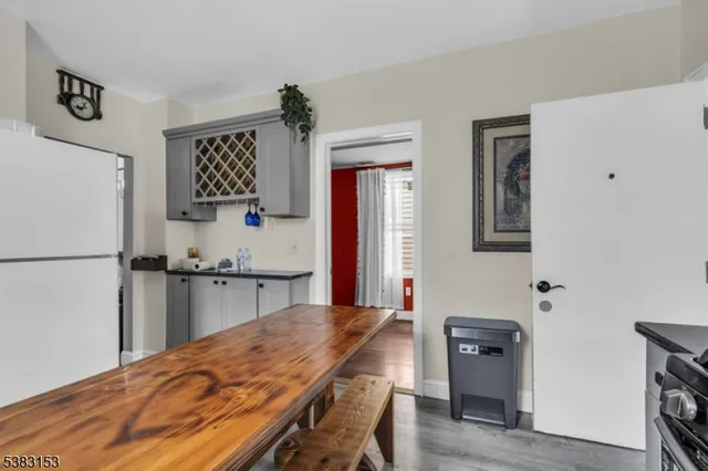 a kitchen with stainless steel appliances granite countertop a refrigerator sink and stove