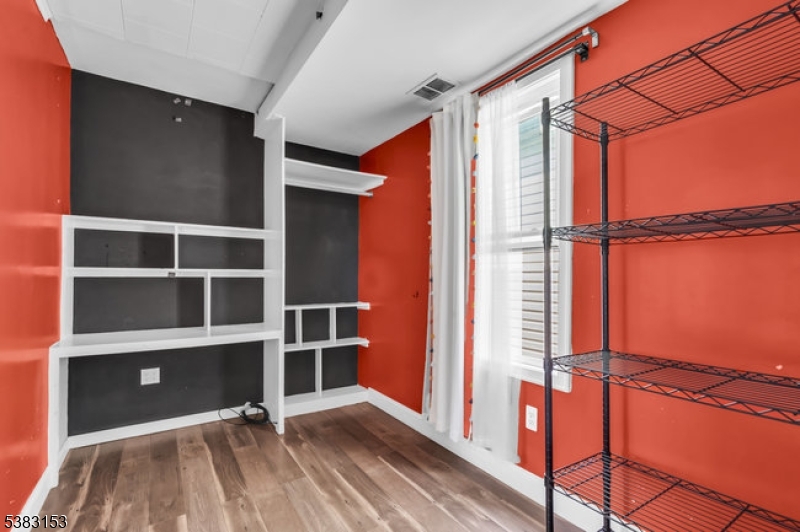 433 3rd Avenue Elizabeth Port, NJ 07206 - Photo 9 of 36 a view of walk in closet with empty racks