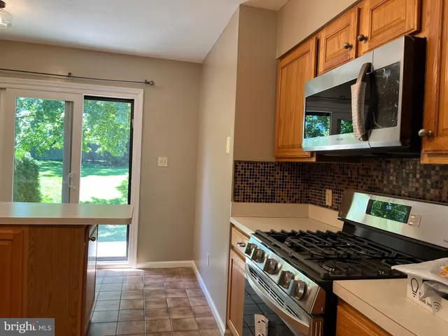 a kitchen with a stove and a microwave
