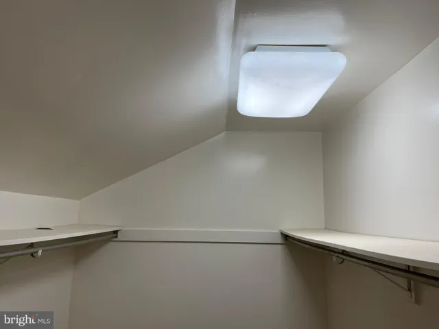 a close view of a utility room with dryer and washer