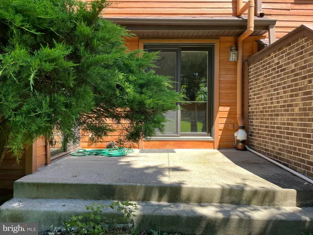 a view of yellow house with a yard