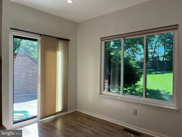 a view of a room that has a large window