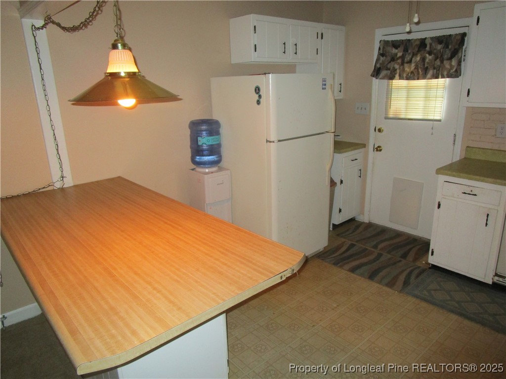 821 Rock Spring Road Fayetteville, NC 28314 - Photo 17 of 23 a bedroom with a bed and a view of kitchen