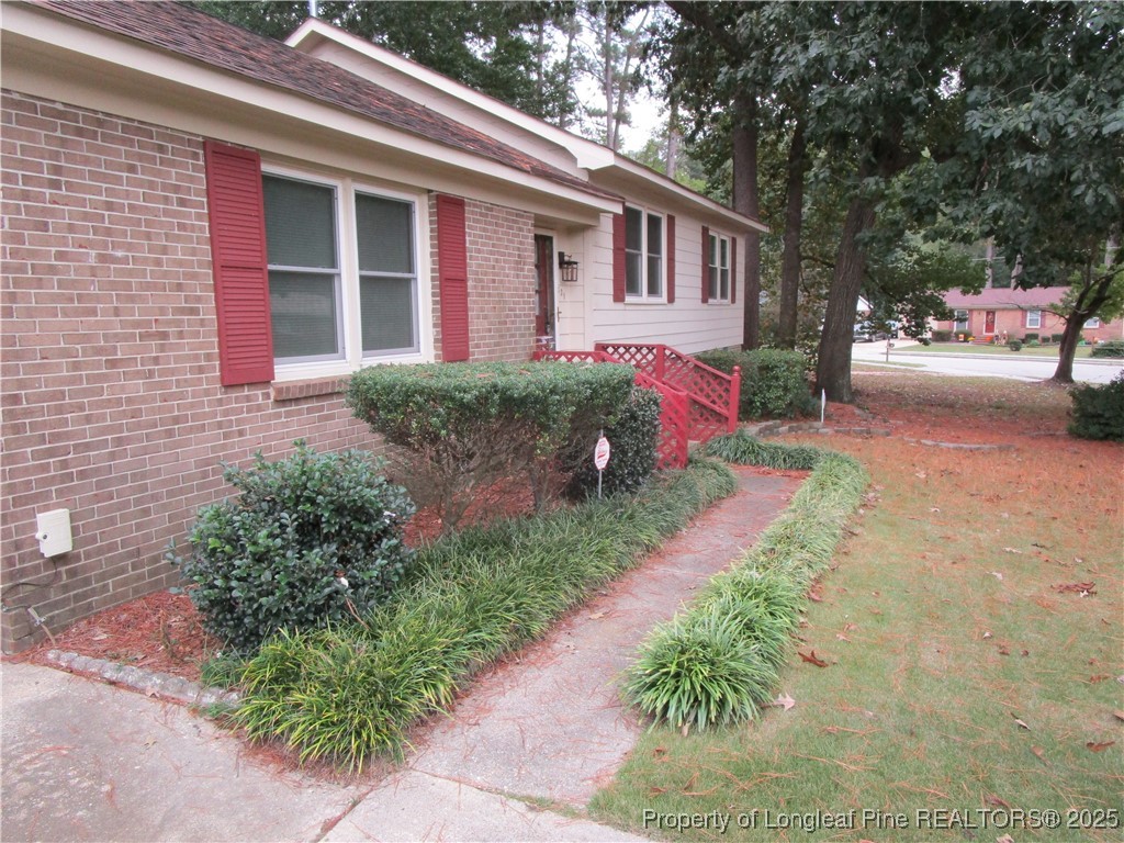 821 Rock Spring Road Fayetteville, NC 28314 - Photo 18 of 23 a front view of a house with garden